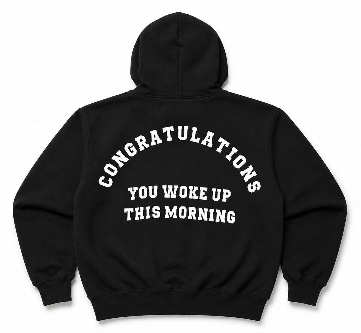 A black pullover hoodie shown from the back, featuring the phrase 'CONGRATULATIONS YOU WOKE UP THIS MORNING' printed in white arched text across the back.