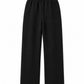 Black wide-leg cropped pants with an elastic waistband, shown flat against a plain white background.