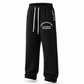 Black sweatpants with white drawstrings and white printed text on the left leg and side, shown on a clean white background.